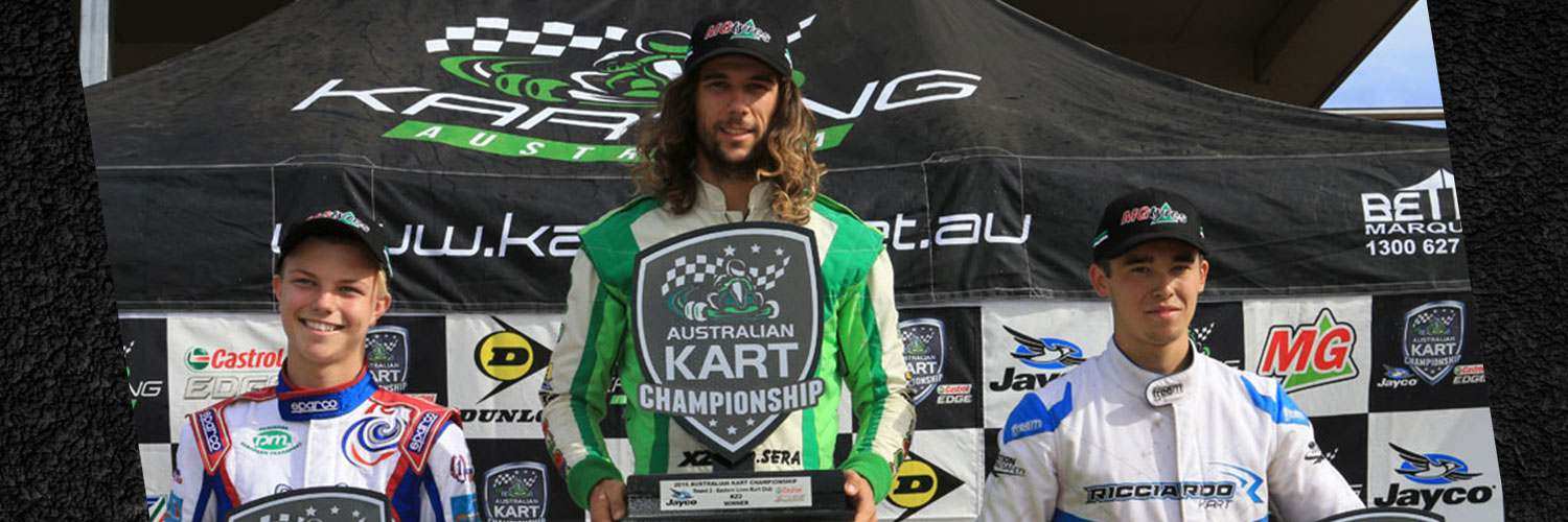 David Sera on the top step of an Australian Kart Championship podium holding the winner board