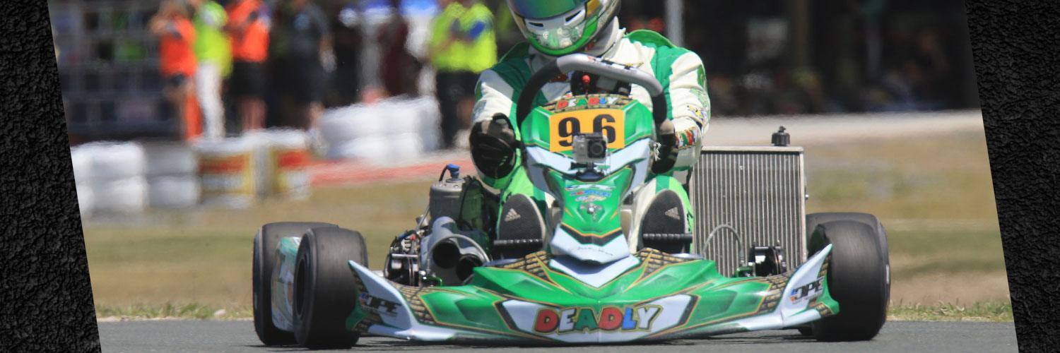 A green and white Sera kart number 96 on track with a camera mounted on the nose